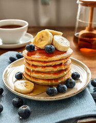 Fluffy Oat Pancakes with Banana, Blueberries, and Honey