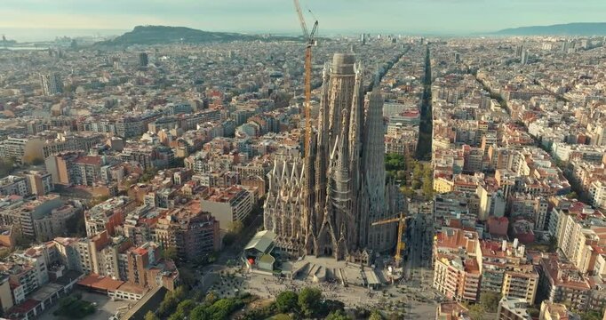 Aerial view Sagrada Familia Barcelona. Cityscape and architecture of downtown with cathedral in touristic city of Spain. High quality 4k footage