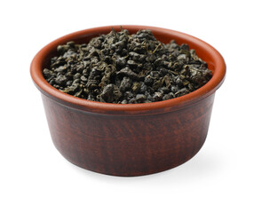 Dry tea leaves in bowl isolated on white