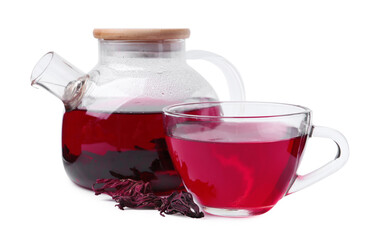 Delicious hibiscus tea in glass cup, teapot and dry roselle sepals isolated on white