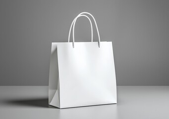 Elegant white shopping bag on gray background