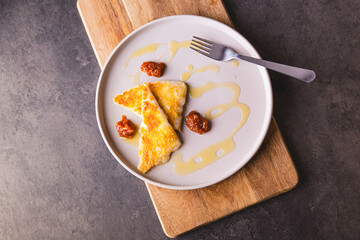 Saganaki Fried Greek Cheese. Traditional dish with Quince sauce