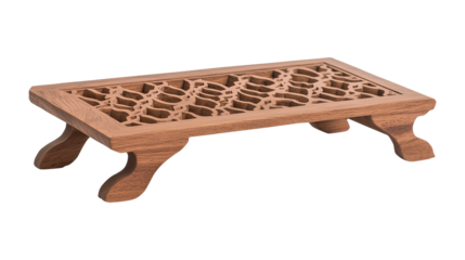 A handcrafted rehal with intricate carvings, open on a transparent background
