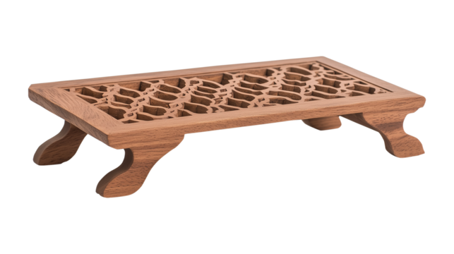 A handcrafted rehal with intricate carvings, open on a transparent background