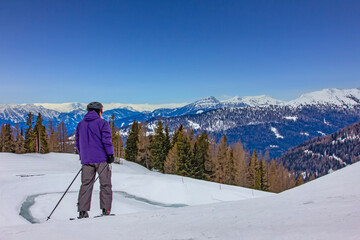Skiers Enjoying Snowy Mountain Slopes