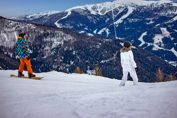 Skiers Enjoying Snowy Mountain Slopes