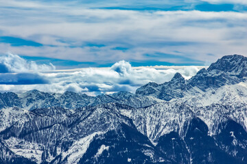 Snowy Mountain Peaks Under Blue Sky