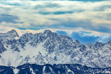 Snowy Mountain Peaks Under Blue Sky
