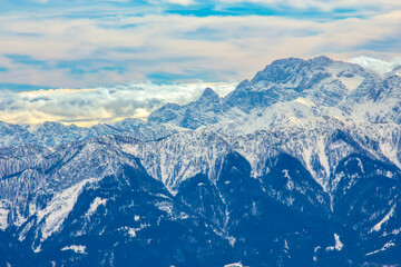 Snowy Mountain Peaks Under Blue Sky