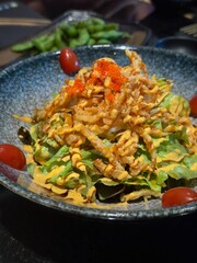 Closeup salad in ceramic plate