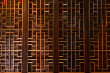 The wooden panels have a lot of small holes in them
