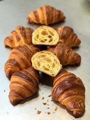 A croissant is a classic French pastry known for its buttery, flaky layers and golden crust. Often enjoyed plain or filled with chocolate, almond, or ham and cheese, it’s a perfect companion for break