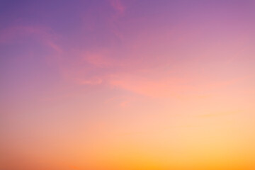 Clouds and pink sky backdrop,A beautiful sky tinted by the sun leaving vibrant shades of gold, pink, blue and multicolored. Clouds in the twilight evening and morning sky.