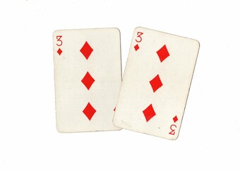 A pair of identical vintage playing cards on a white background.