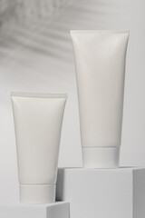 white cosmetic packaging with palm leaf 