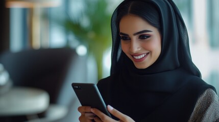 A joyful Arab woman wearing a stylish abaya interacts with her mobile phone, smiling effortlessly as she navigates through her favorite apps in a trendy cafe filled with natural light.
