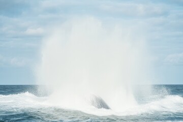 Majestic whale breaching ocean surface, creating spectacular wat