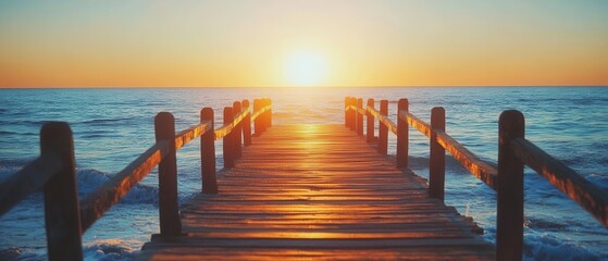 Fototapeta premium Serene Ocean Sunrise Pier Perspective Golden Hour Tranquil Seascape Wooden Path to Horizon Coastal Calm Warm Light Beautiful Nature Scene