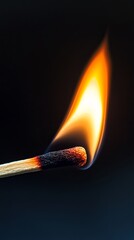 A powerful close-up of a burning matchstick with an intense orange flame, symbolizing ignition, energy, and transformation.