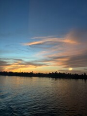 Naklejka premium sunset over the river