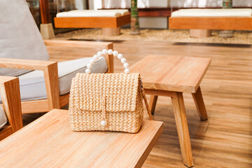 Rattan bag on wooden table,Straw bags or wicker bags,wicker baskets made of natural material,vintage weave wicker baskets,space for sale,copy space.