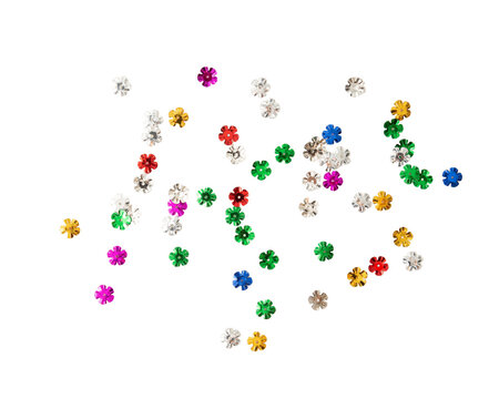 Colorful flower shaped sequins scattered on transparency background, perfect for crafts