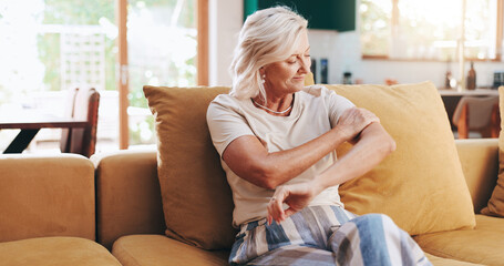 Recovery, calm and senior woman in home, living room or smile for healing of arthritis joints or muscle. Lounge, physical therapy and treatment for improved mobility, happy or rehabilitation in house