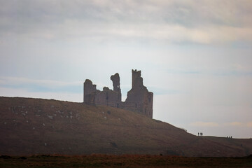 Obraz premium Embleton Bay, with Dunstanburgh Castle, landscape shots including long exposure images. 