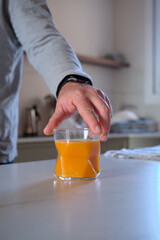 A glass of orange juice on the table