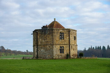 Fototapeta premium the conduit house the round tower or water tower of cowdray house Midhurst West Sussex England