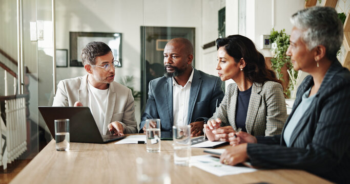Meeting, laptop and business people in office for finance investment with company online. Collaboration, computer and financial management team with profit or revenue margin report in boardroom.
