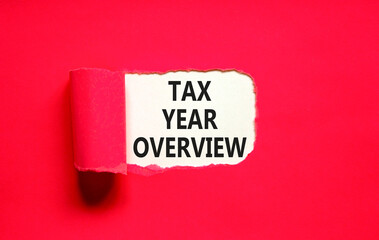Tax year overview symbol. Concept words Tax year overview on beautiful white paper. Beautiful red table red background. Business tax year overview concept. Copy space.