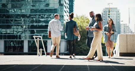Business, people and walking in city with discussion for campaign ideas, project planning and...