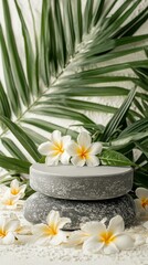 Gray stone podium with frangipani flowers