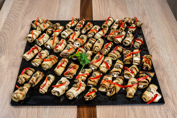 Elegant platter of eggplant rolls beautifully presented perfect for appetizers or a delightful gathering