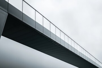 Fototapeta premium Innovative transparent bridge soaring into the sky under soft atmospheric lighting