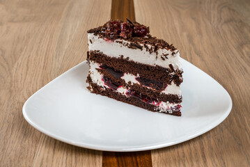 Delicious Slice of Chocolate Cherry Cake: Layers of flavor and sweet delight! Perfect dessert treat
