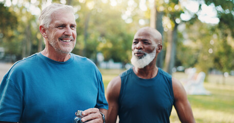 Senior, men and walking for fitness outdoor of mobility training, bonding discussion and morning routine. Smile, elderly friends and talking of support, retirement exercise and cardio workout at park