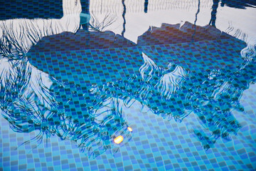 Pool water, reflection. The bottom is visible. Relaxing and swimming