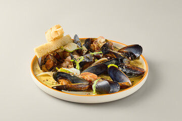 Elegant Mussels in Wine Sauce with Gourmet Presentation and Soft Lighting