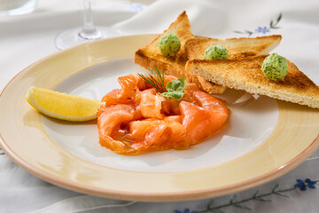 Gourmet Lightly Salted Salmon with Toasts on Elegant Table Setting