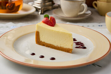 Classic Cheesecake Slice with Elegant Presentation in Warm, Inviting Lighting