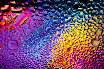 Close-up of water drops on metal surface in high resolution showing condensation of water droplets on metal surface. Intricate patterns and different sized water droplets create a beautiful abstract