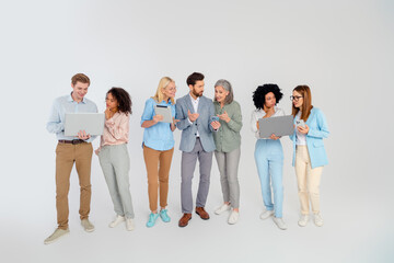 Naklejka premium Group of diverse professionals working together on grey background, teamwork for collaboration