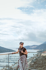 Young woman embracing the freedom of solo travel and digital nomad lifestyle while enjoying a...