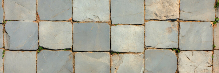 Rustic asymmetric square grid stone texture for artistic and architectural design