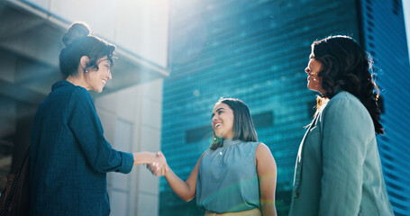 Business, women and meeting with handshake in city for introduction, greeting or hiring. Female...