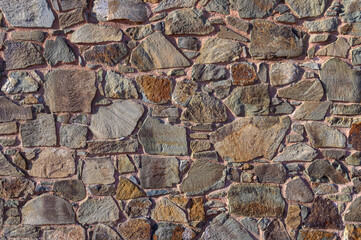 Beautifully textured stone wall showcasing nature's artistry in a serene outdoor setting