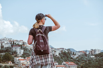 Young woman embracing the freedom of solo travel and digital nomad lifestyle while enjoying a...