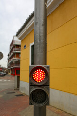 Traffic light on a street in Madrid, in its different colors and figures, whether red, green, amber...
